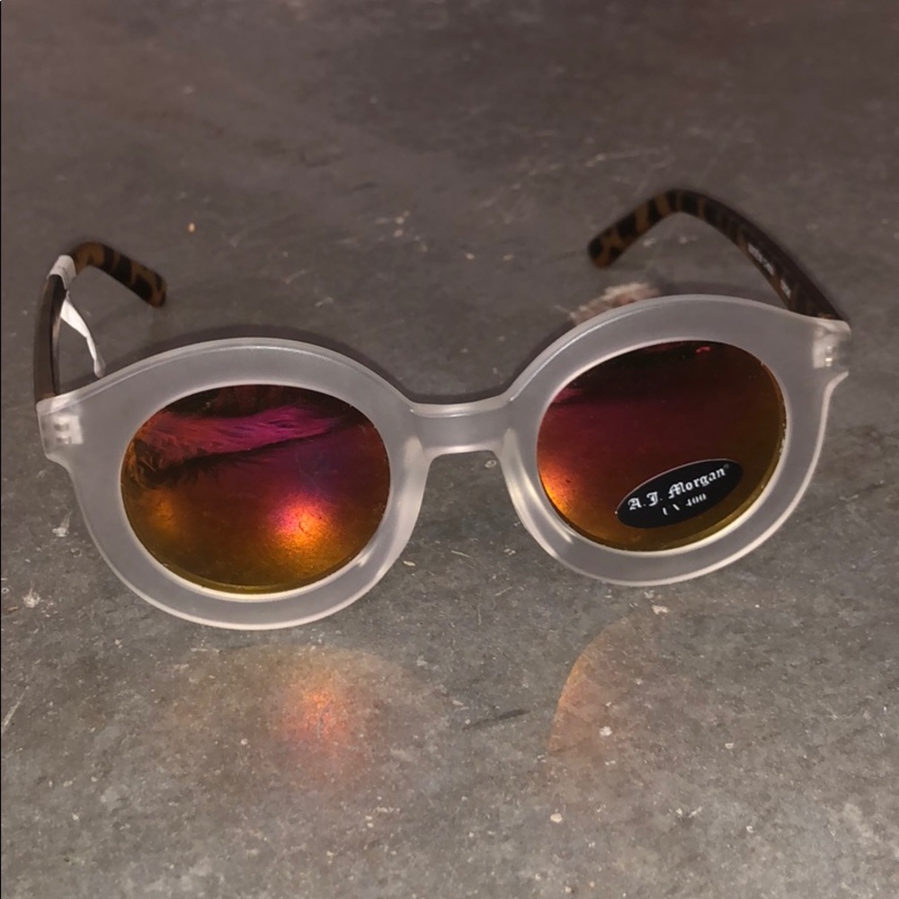 Clear/tortoise sunglasses with red/orange lenses